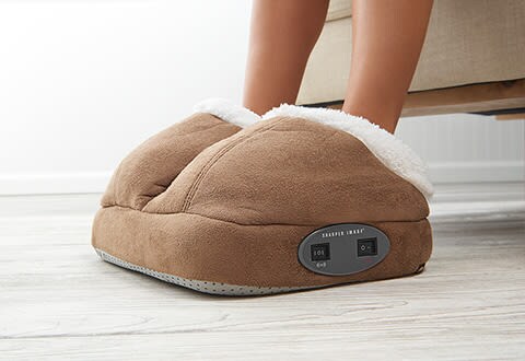 brown and white foot massager