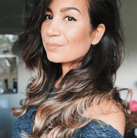 Influencer Serena Verbon weraing blue lace top and ombre hair