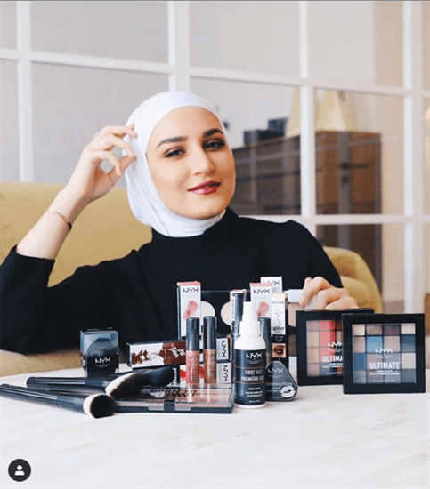 Kuawiti fashion and beauty influencer Dalal Al Doub with an array of beauty products