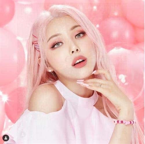 South Korean beauty influencer PONY surrounded by pink balloons and wearing all pink
