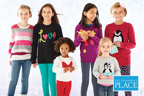 Six kids smiling in sweaters from The Children's Place