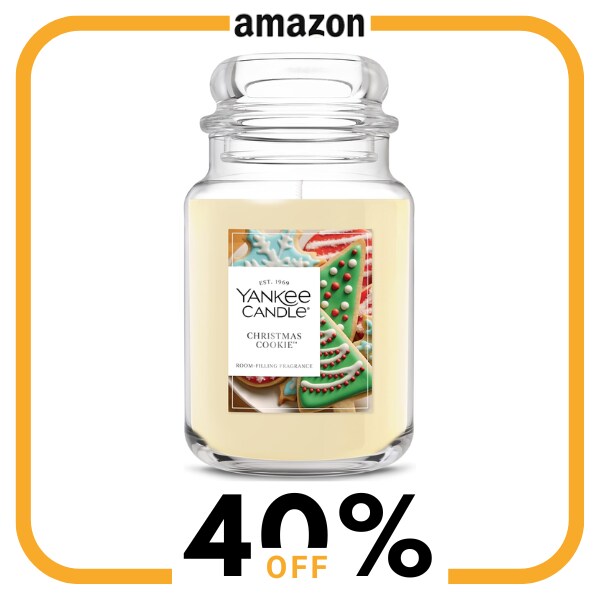 A white candle in a glass jar with a lid