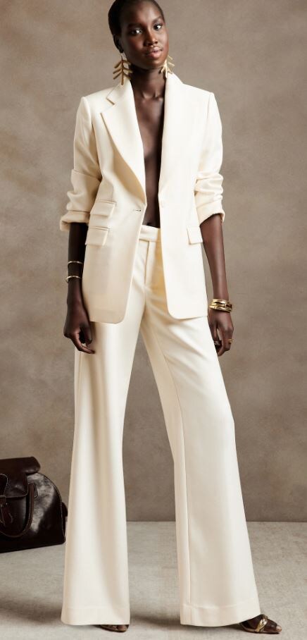 woman wearing transition white cream blazer and matching wide-leg italian wool pant