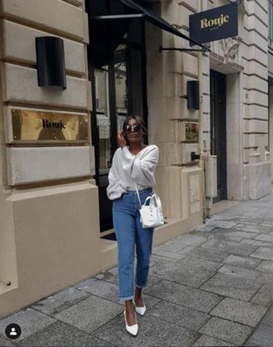 French influencer Aïda bringing minimalist style to denim and a white blouse on the streets of Paris
