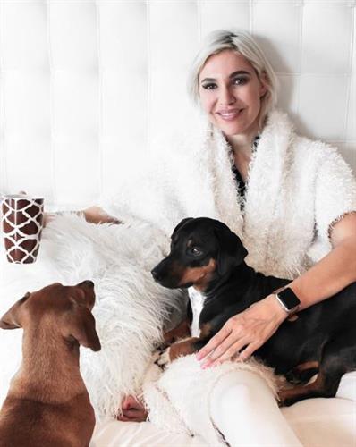 Motivational speaker and influencer Liezel van der Westhuizen enjoying a cup of coffee with her two dogs