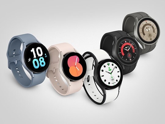 5 Samsung Galaxy Watch5 smartwatches in different colors against a white background.