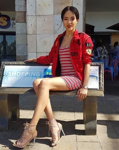 Actress and Voiceover Artist Seneo Mabengano sitting on a bench 