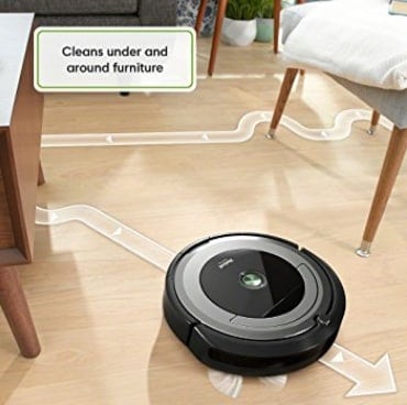 Roomba vacuum over hardwood floor