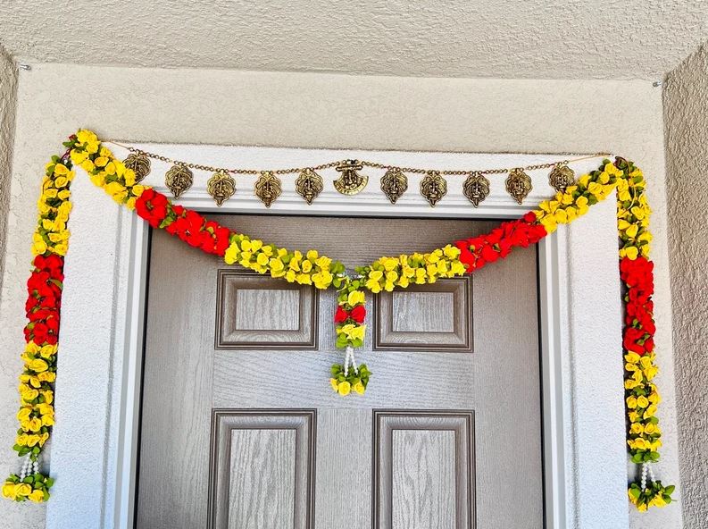 red and yellow metal door hanging for diwali