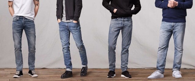 Four men wearing different Levi's jeans
