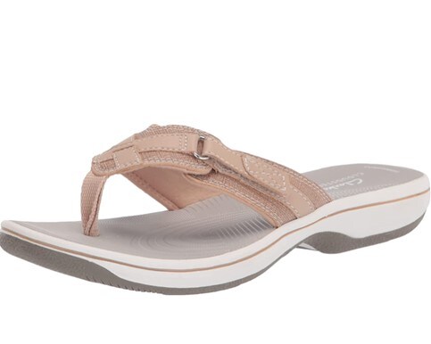 A single, soft pink and white Clarks breeze sea flip-flop with adjustable strap.