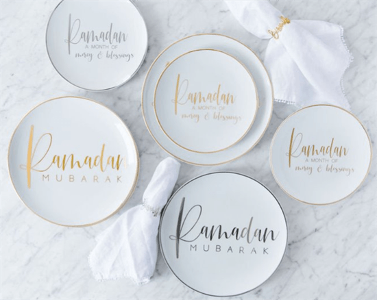 Elegant place settings for Ramadan in white with silver and gold lettering