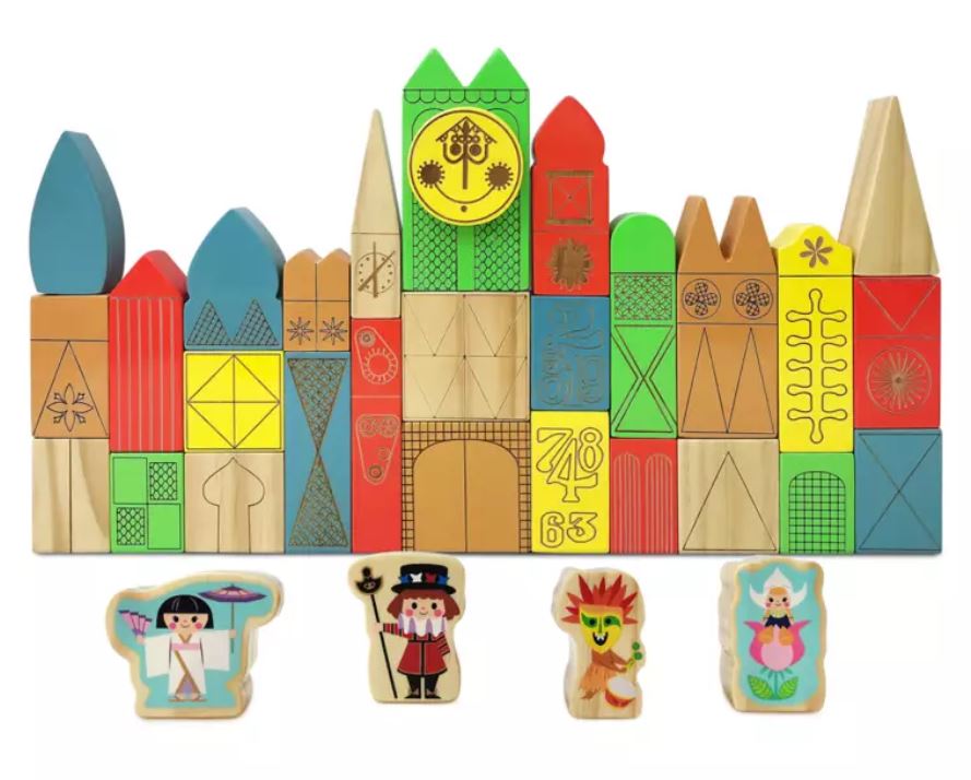 wooden block set of Disney theme park ride Its a Small World with four wooden figurines