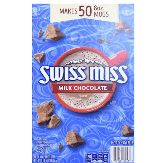 A blue box of Swiss Miss Milk Chocolate Flavored Hot Cocoa Mix featuring chunks of chocolate and a red mug full of hot cocoa in the middle