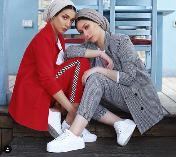 Suzanna & Nesma Kadry posing in checkered outfits styled by them