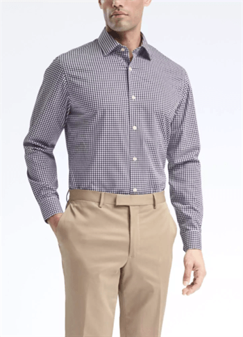 Black small checkered dress shirt with khakis on man