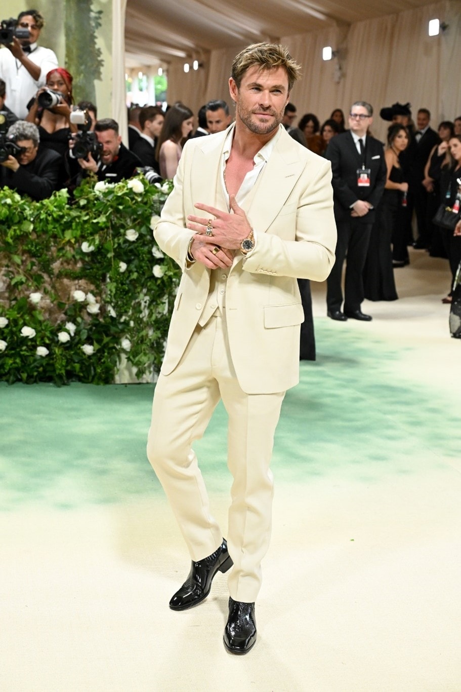 man wearing a tan colored suit