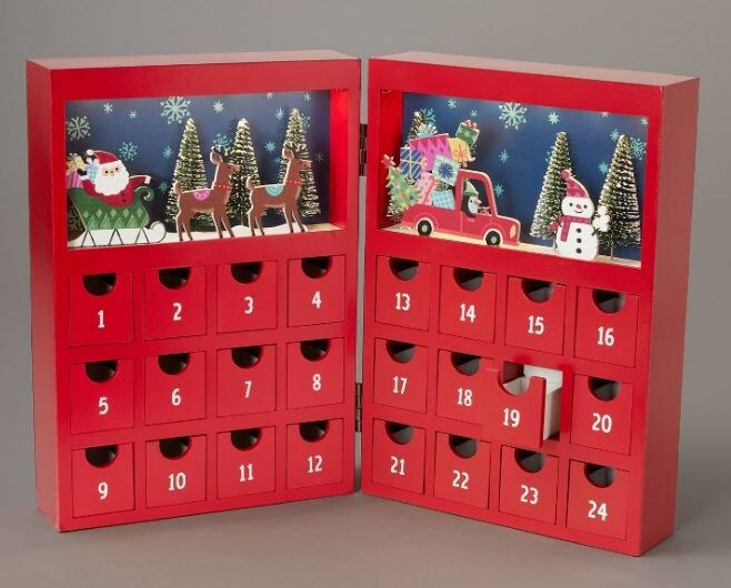 red advent calendar with images of santa on sleigh, reindeer, a penguin driving a car with gifts, and a snowman