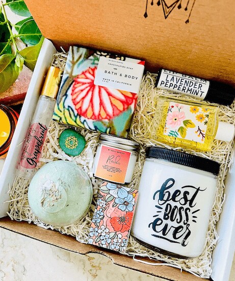 A pack of MyDailyMantra Deluxe Best Boss Ever Gift Set featuring candles, bath bombs, handcrafted soap, and lip balm