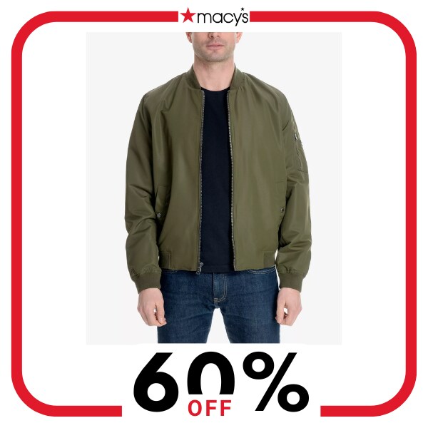 A man wearing a green jacket