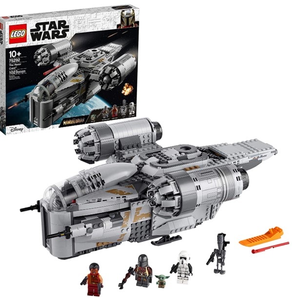 A photo of the built LEGO Razor Crest with the LEGO Star Wars box in the background and the 5 mini-figures in front of the ship