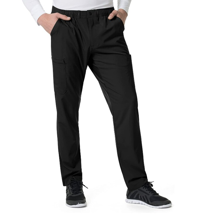 Man modeling black chino pants and black sneakers