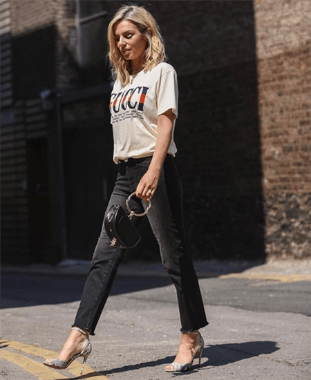 Blogger Pippa O'Connor Ormond wearing t-shirt that says Gucci and black jeans