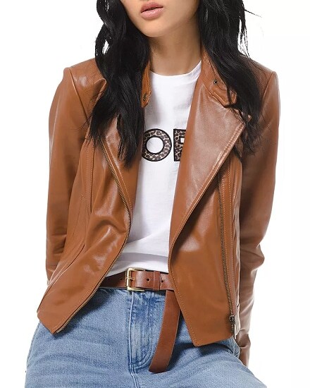 A brown leather moto jacket combined with a white T-shirt and blue jeans with a brown belt