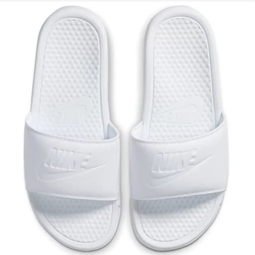 A pair of plain white Nike Women's Benassi Sandals with leather sole and the Nike logo on both sandals