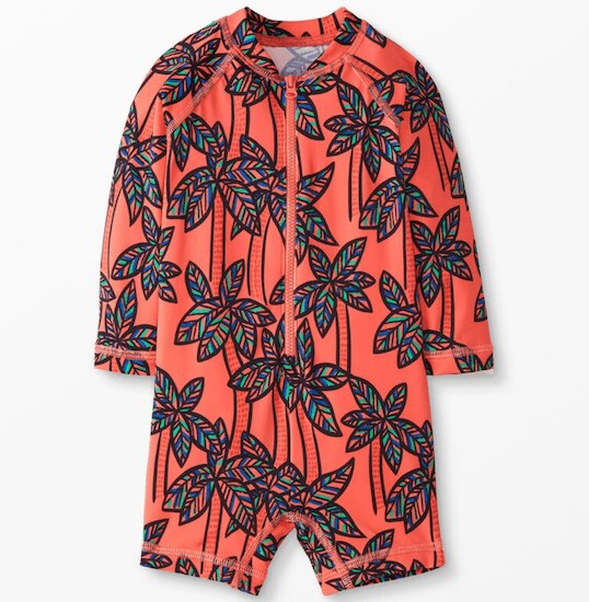 A Baby Rash Guard Suit full of Orange Palm Tree designs