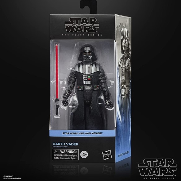A photo of a front-facing Black Series Darth Vader figurine box with a transparent part in the middle showing Darth Vader and his red lightsaber next to him