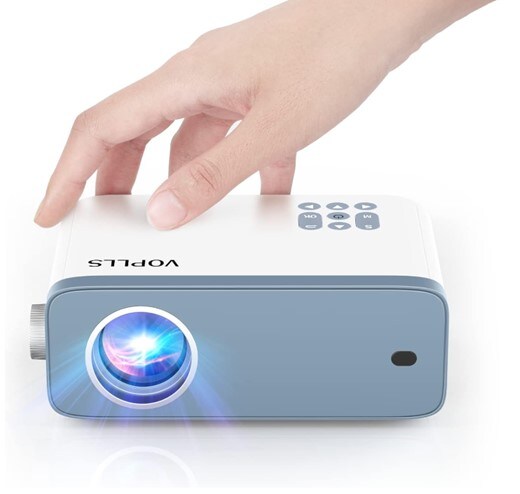 A hand reaching out for a white and pale blue VOPLLS compact projector