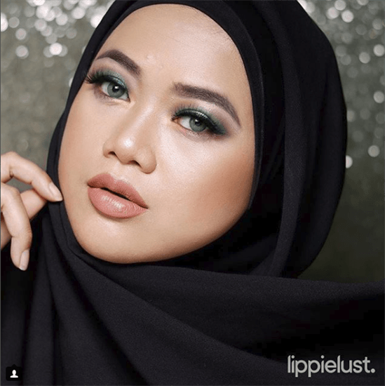Influencer Rissa wearing black hijab and colorful eye makeup