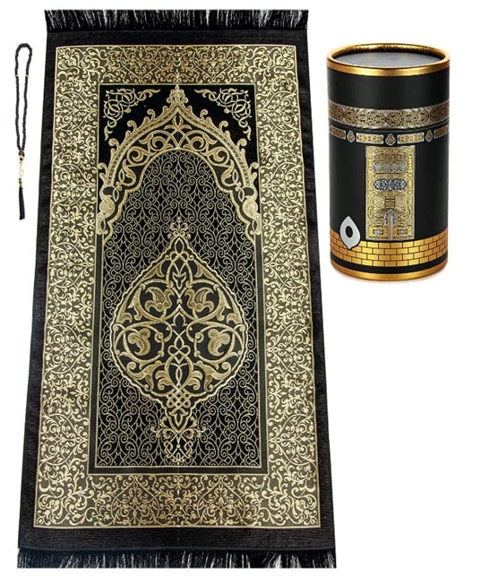 A photo displaying the black prayer beads on the left, the Islamic praying rug in gold and black in the center, and the black and gold cylinder with Islamic art motifs on the right.