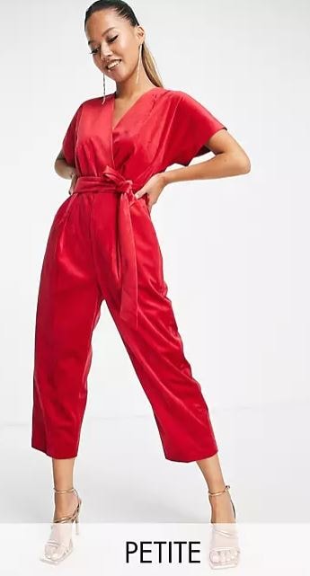 woman with long earrings wearing a velvet red Close London Wrap Jumpsuit with strappy heels