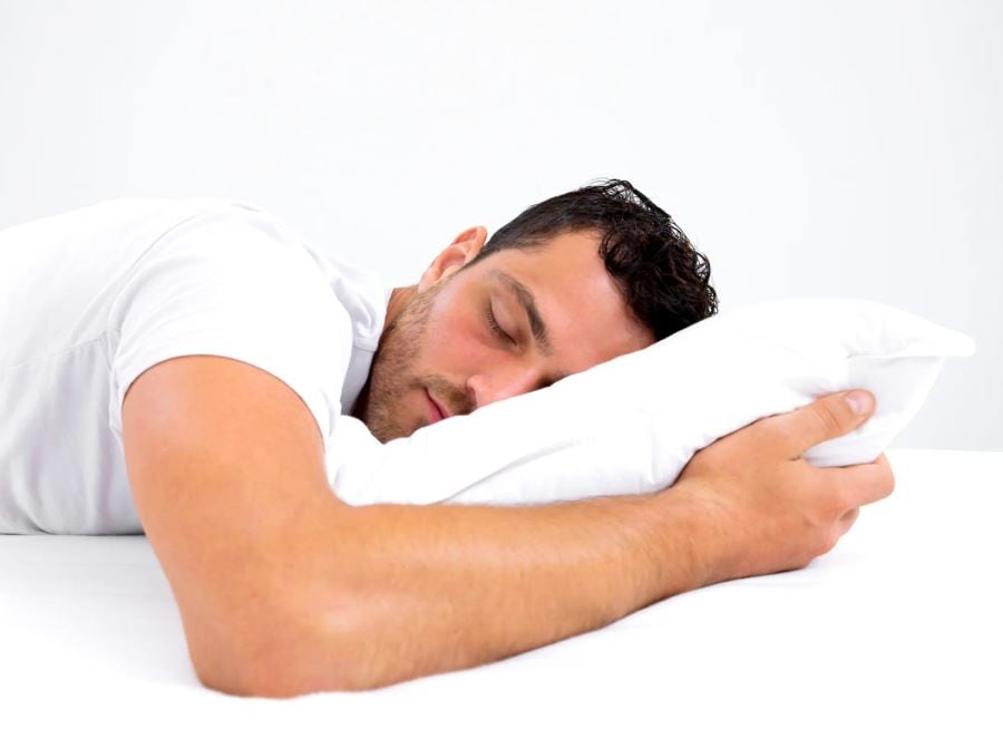 image of man sleeping on a pillow