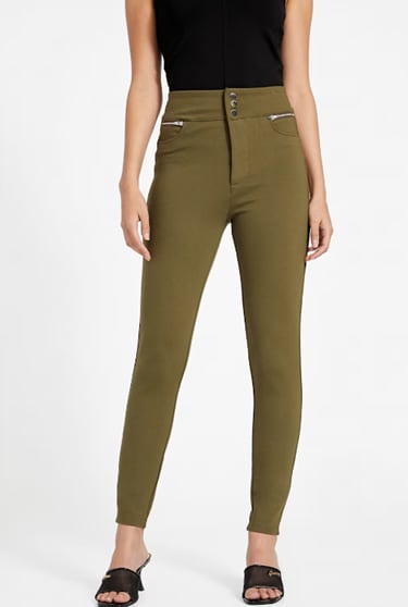 A woman wearing olive green pants