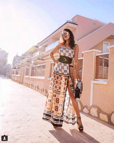 Influencer Tamara Gonzalez Perea wearing strapless patterned formal dress and heels