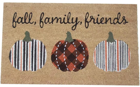 A tan Celebrate Together “Fall Family Friends” Fall-themed Coir Doormat with three multicolored pumpkins and black cursive words