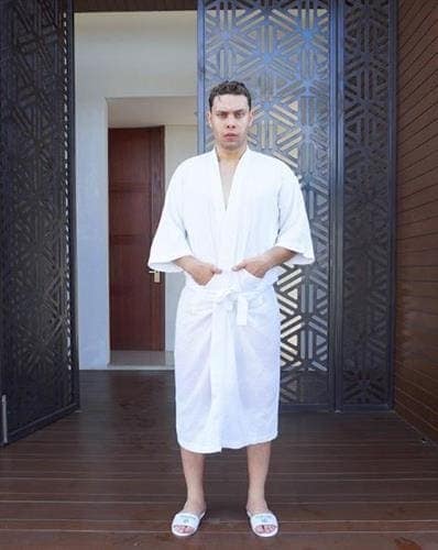 Arabic video producer Ahmed Hassan Hussein posing in a robe