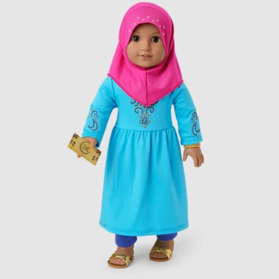 American girl doll wearing a blue abaya and pink hijab