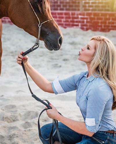 Animal lover and social media influencer Georgina Wiggins blowing a kiss to her horse, Rocket Boy