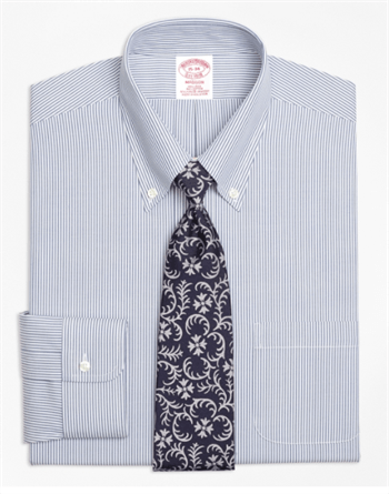 Gray dress shirt folded with patterned tie