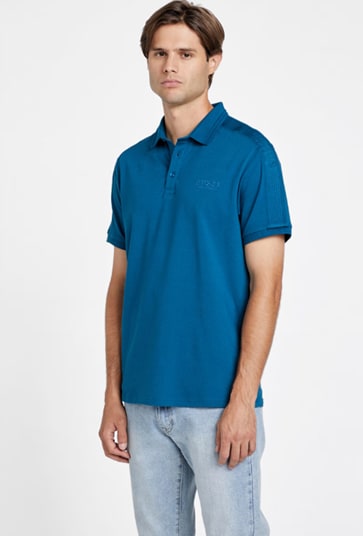 A man wearing a blue polo