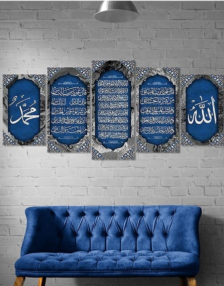 A 5-piece blue-and-silver Islamic calligraphy art print hanged on a white brick wall. There is a fitting blue sofa underneath it.