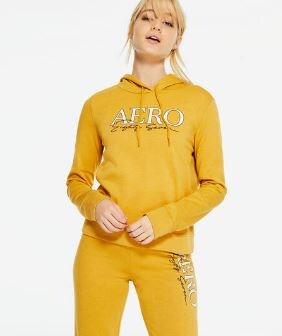 woman wearing a yellow aeropostle brand jumpsuit