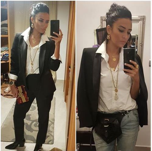 Egyptian influencer Yasmine Ghaith taking selfies in a black suit