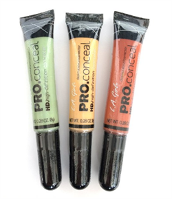 Three colored concealer tubes