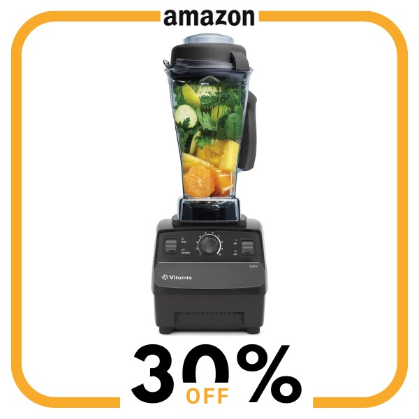 A black blender with food inside