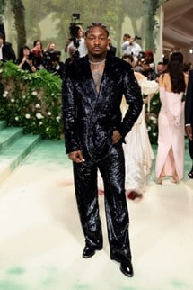 celebrity Stephon Diggs wearing a sparkling black suit